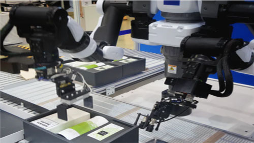 Robotic arms at work.