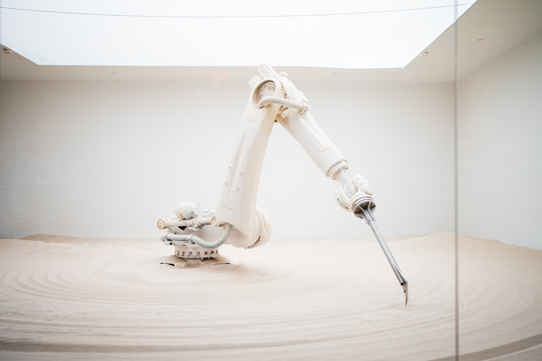 Humanoid robot and industrial robot arm comparison in a manufacturing environment