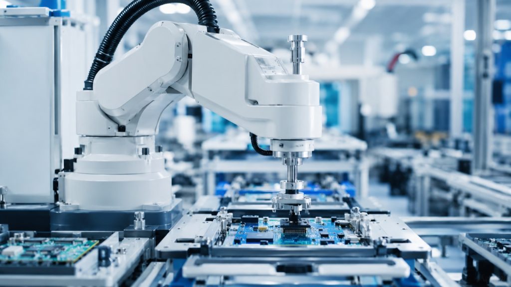 SCARA robot arm placing a component onto a PCB on a 3C electronics assembly line