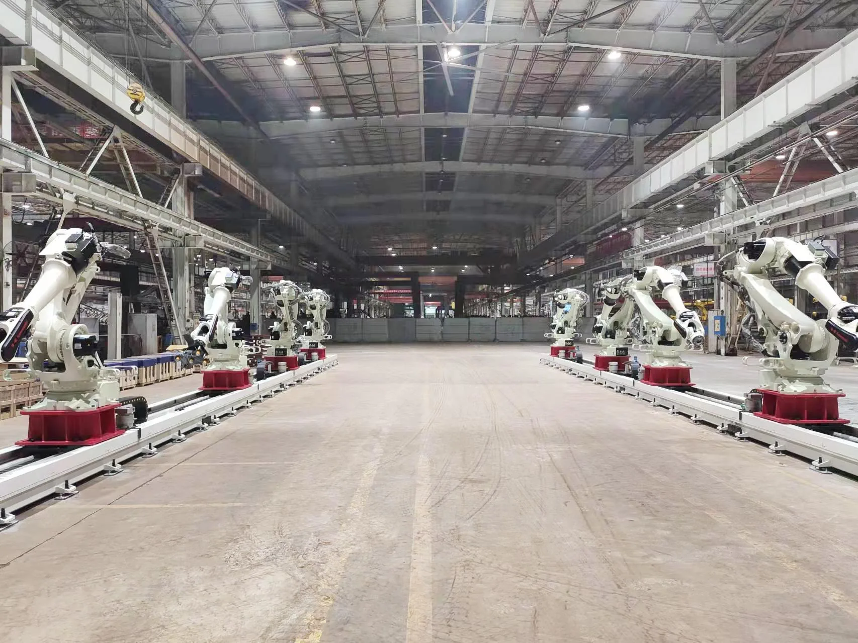 Robot track in the foreground with multiple robots farther along the line