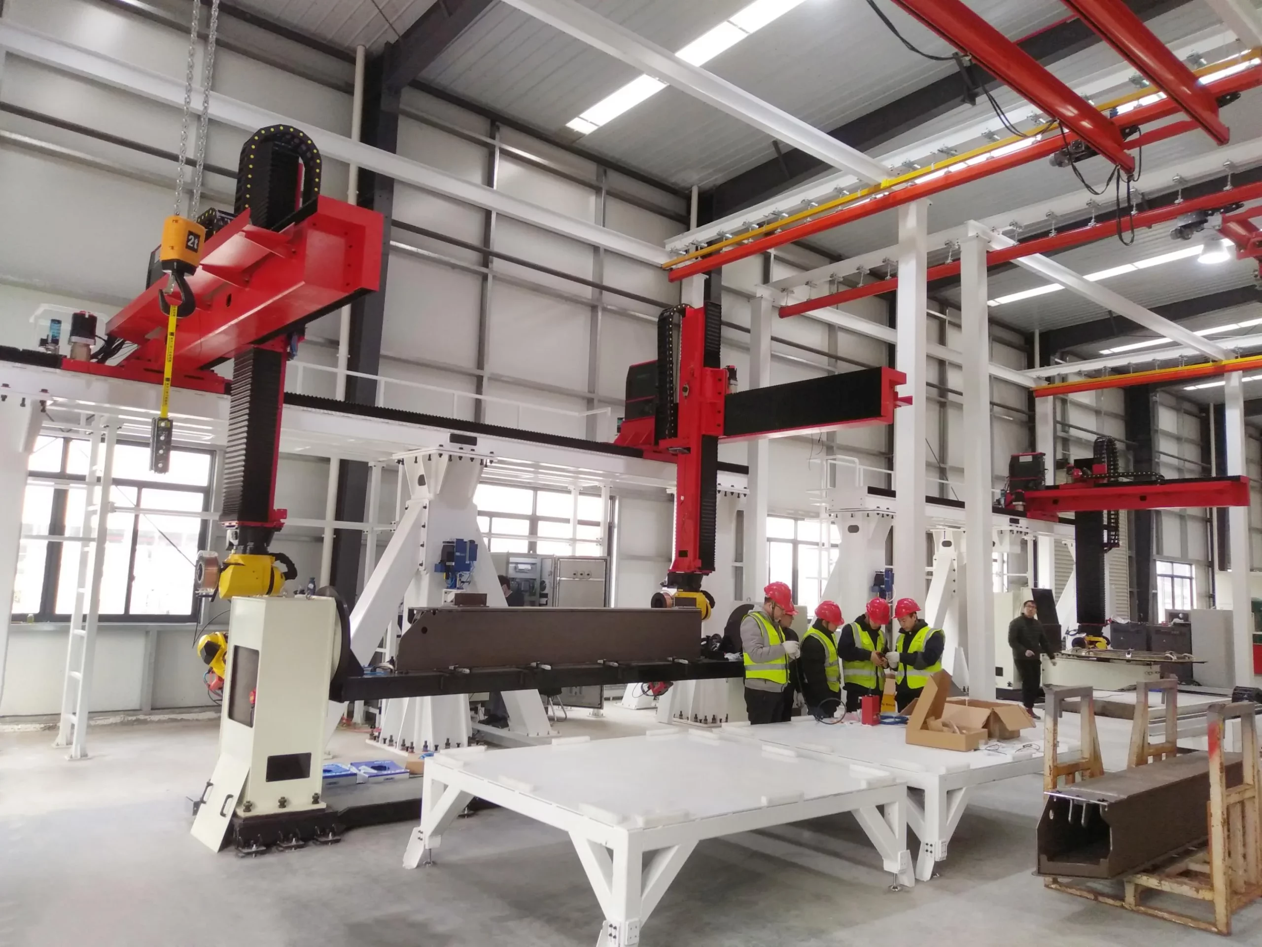 Truss motion systems installed above welding fixtures