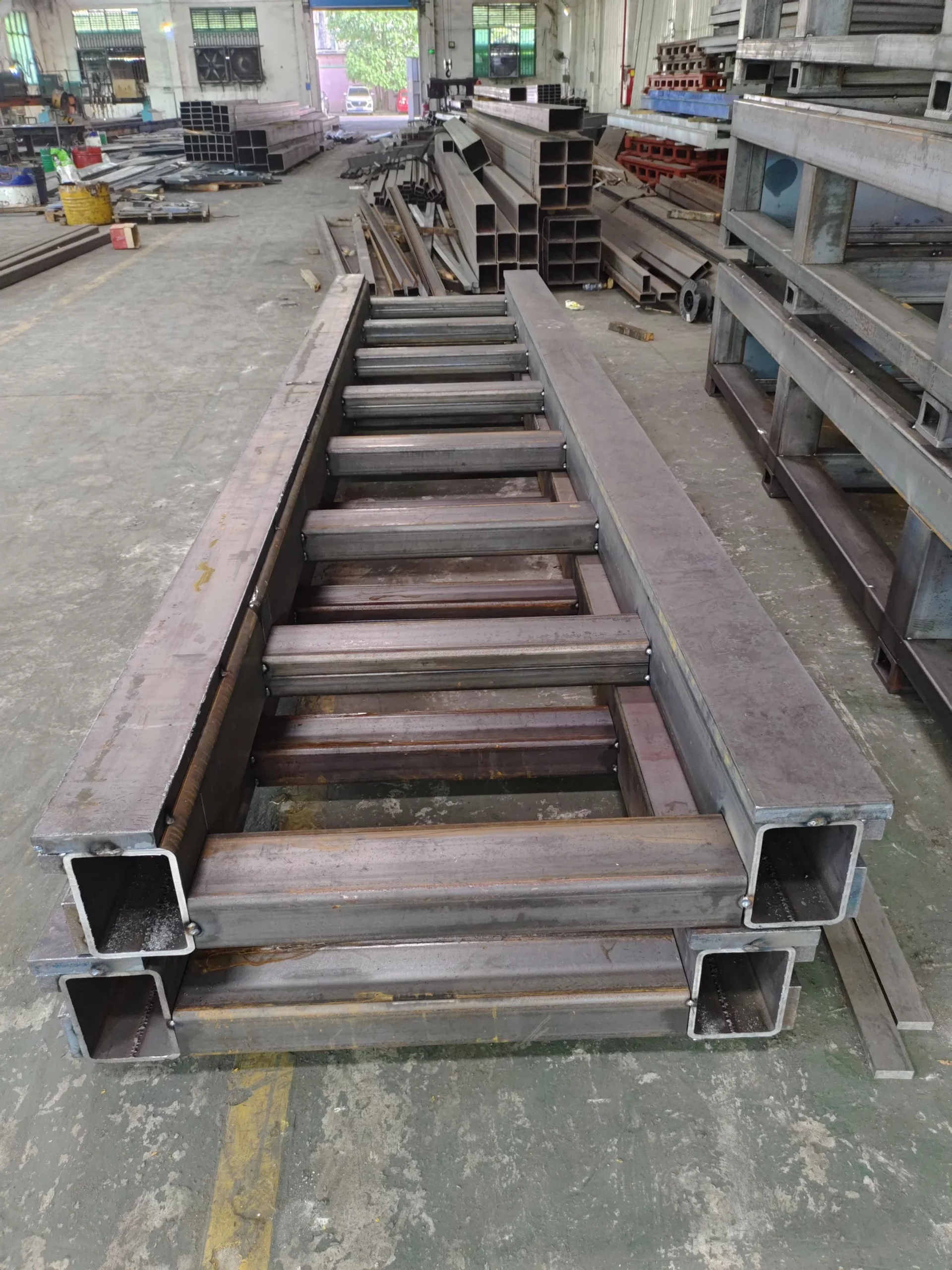 Welded steel track frame under fabrication