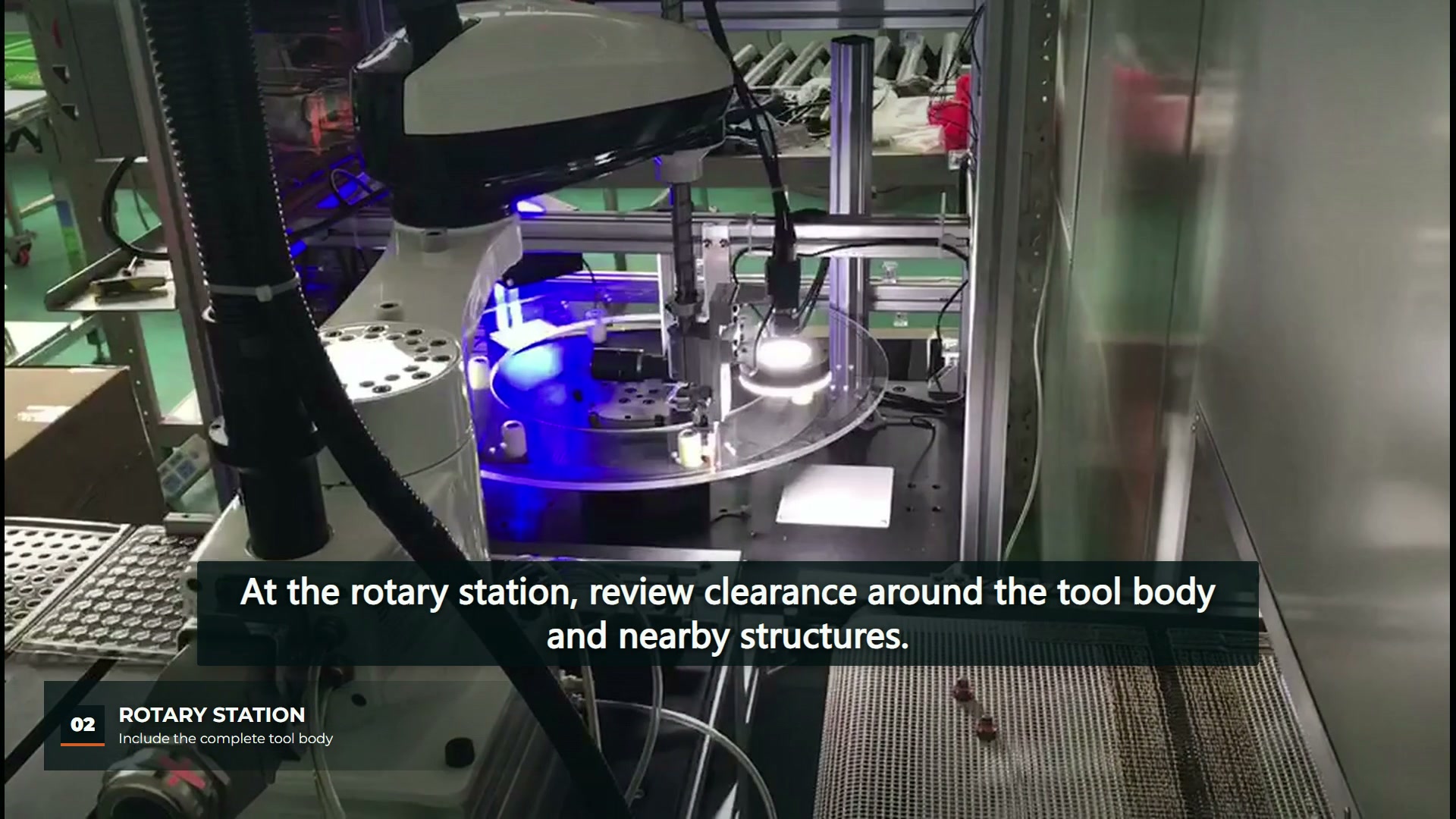 SCARA tool above an illuminated rotary station and its surrounding table structure