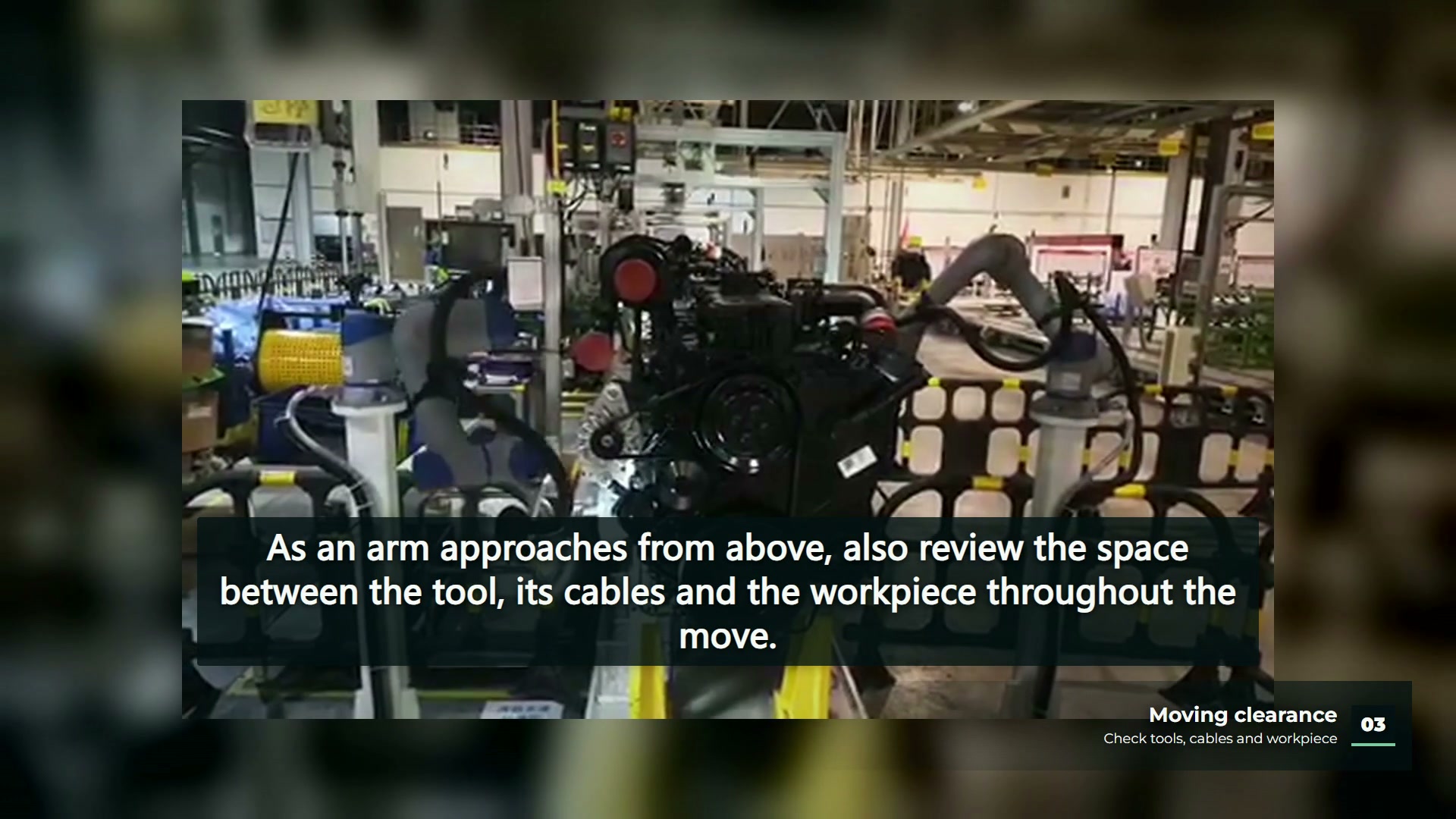 Two robot arms positioned around a workpiece with inspection lighting