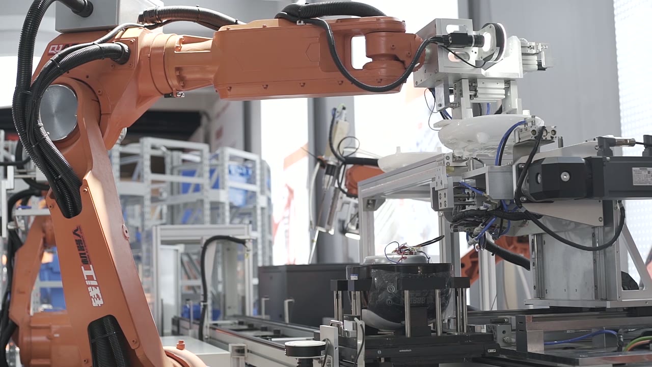A robot places a part onto the body
