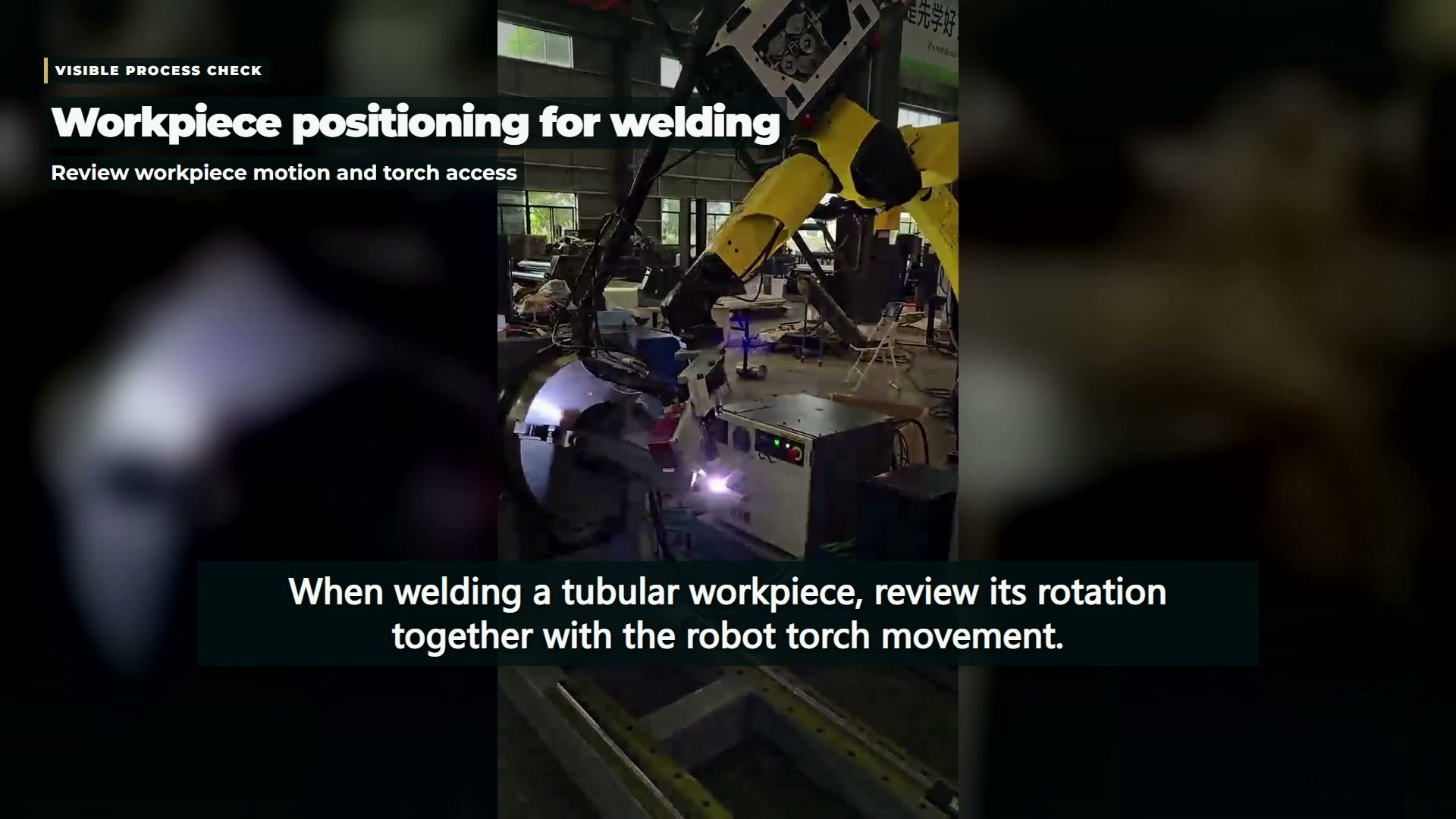 Robot torch near a tubular weldment held in a rotating support