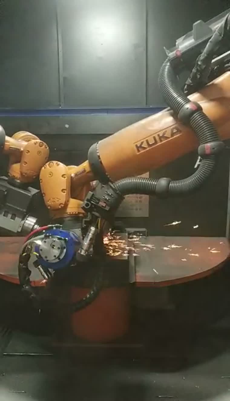 Tool-held robot working around a clamped casting