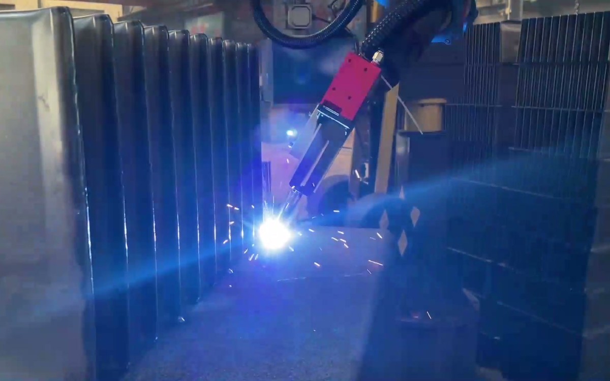 Robot welding transformer tank walls and reinforcement ribs