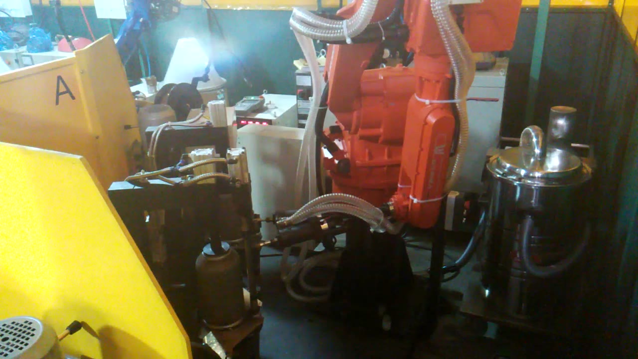 Robot tool reaching a lower position in front of the rotary fixture