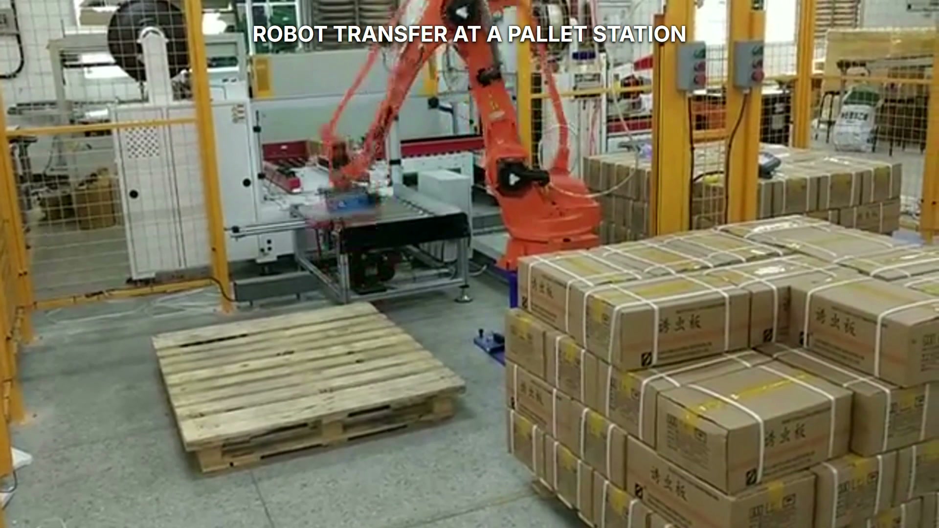 The robot and suction-cup end effector approach the wooden pallet area.