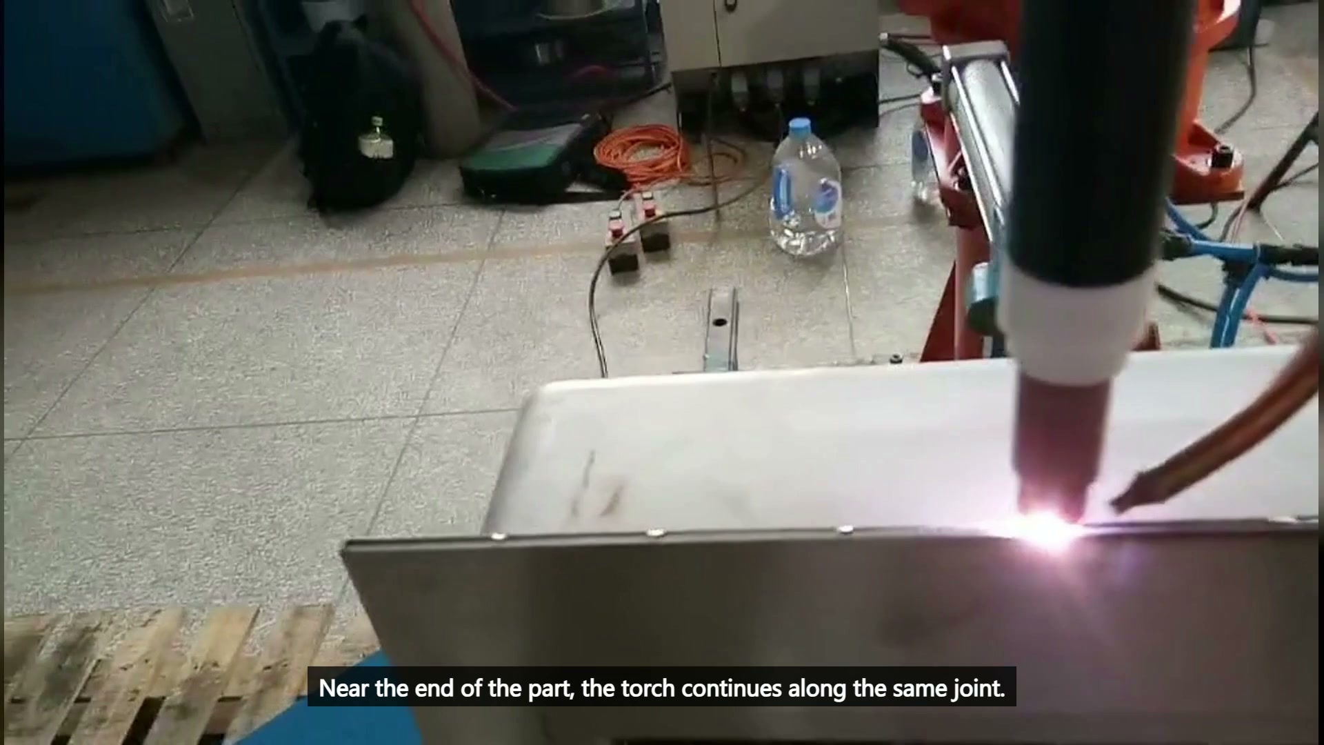 Torch and weld pool approaching the end of the long joint