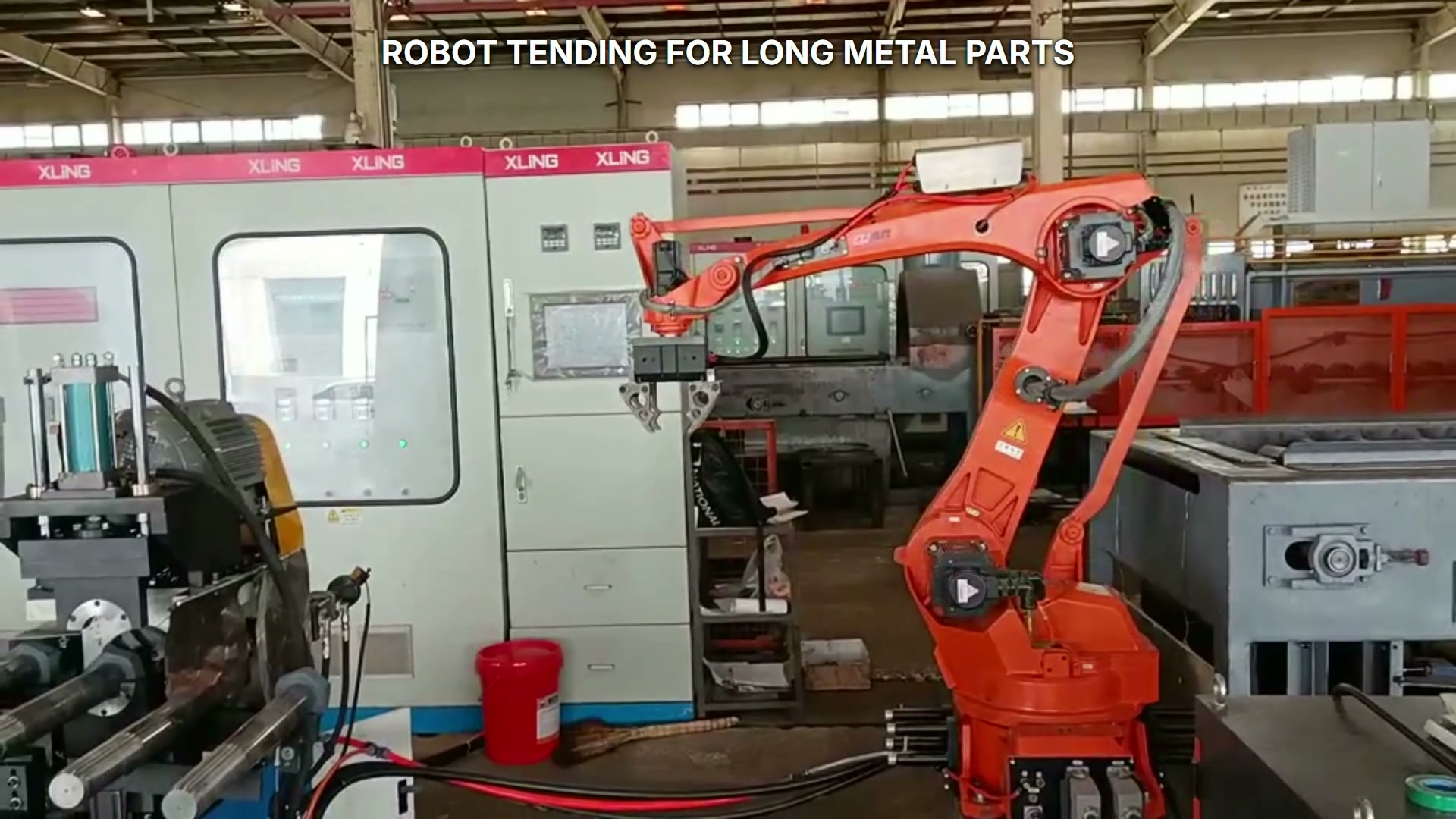 The gripper is positioned at the left machine or holding station.